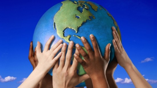 Hands on a globe --- Image by © Royalty-Free/Corbis